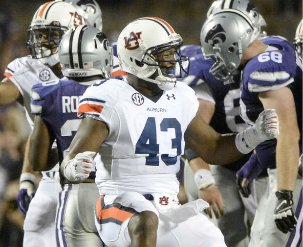 Anthony Swain (#43) celebrates a tackle against Kansas State. Swain is no longer with the Auburn Tigers ((Mark Almond/malmond@al.com)