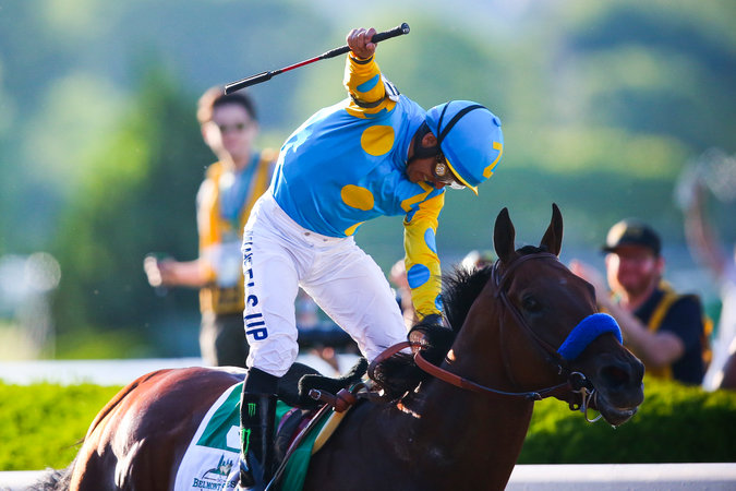 American Pharoah winning the 2015 Belmont Stakes with Victor Espinoza aboard (Chang W. Lee/The New York Times)